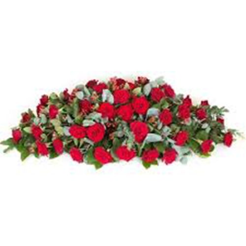 Beautiful red rose casket spray funeral flower arrangement with fresh roses and greenery by Purple Orchid Florist